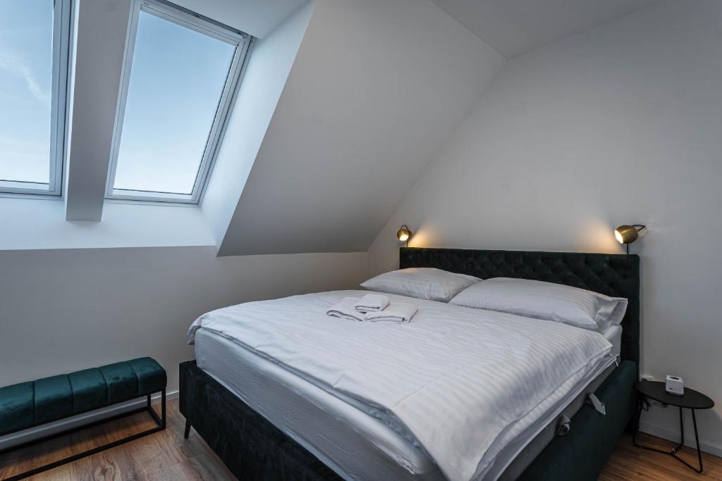 Postel nebo postele na pokoji v ubytování Residence Krušec