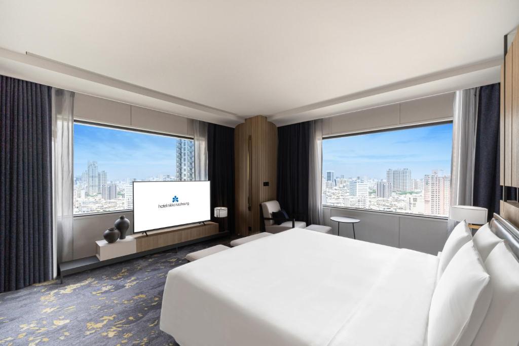 Postel nebo postele na pokoji v ubytování Hotel Nikko Kaohsiung