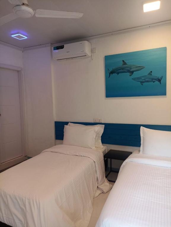 Postel nebo postele na pokoji v ubytování Kendhoo holidays