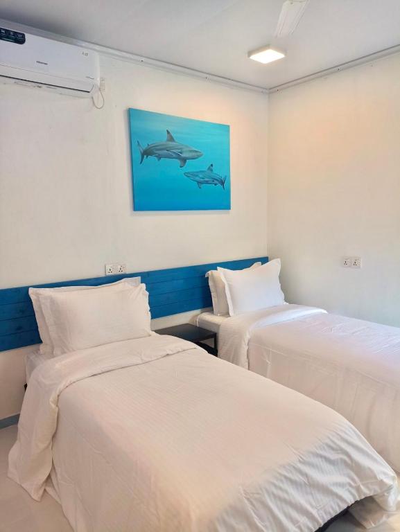 Postel nebo postele na pokoji v ubytování Kendhoo holidays