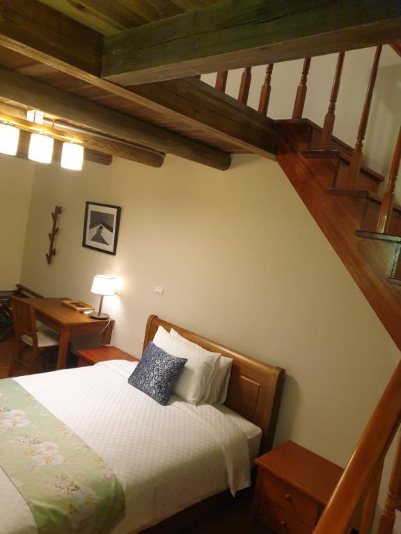 Postel nebo postele na pokoji v ubytování Mount Taiwu Cozy B&B