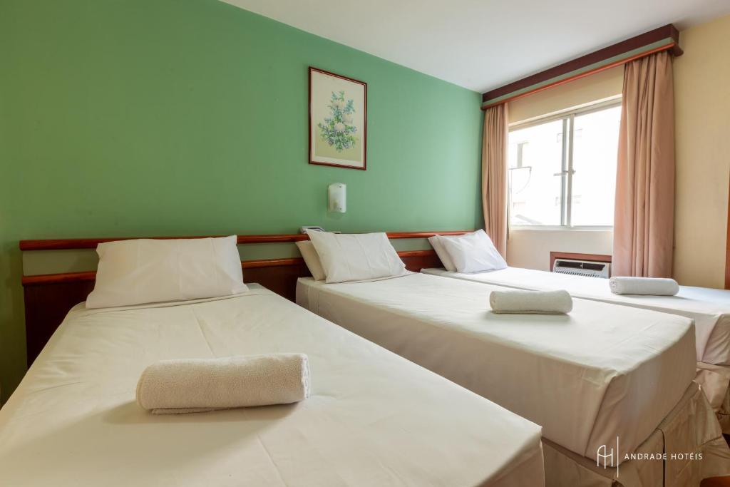 Postel nebo postele na pokoji v ubytování Rede Andrade Mercado Hotel
