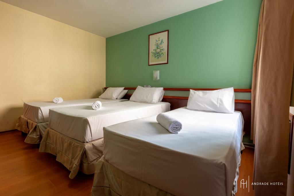 Postel nebo postele na pokoji v ubytování Rede Andrade Mercado Hotel