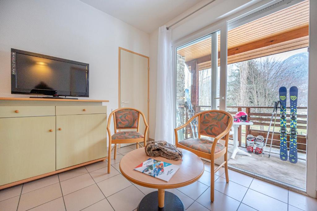 TV a/nebo společenská místnost v ubytování Village Club Les Balcons des Pyrénées
