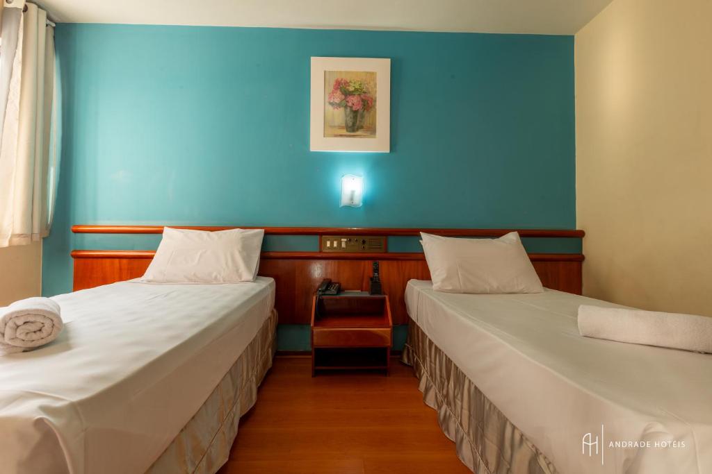 Postel nebo postele na pokoji v ubytování Rede Andrade Mercado Hotel