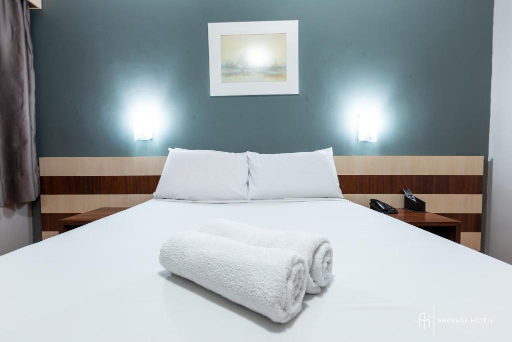 Postel nebo postele na pokoji v ubytování Rede Andrade Mercado Hotel