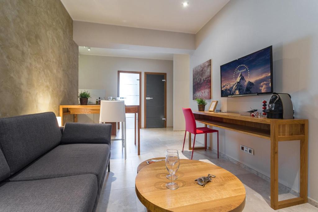 a living room with a couch and a table at Villa Velvet in Villeneuve-Loubet