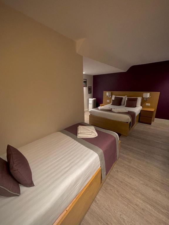 Postel nebo postele na pokoji v ubytování Holtwhites Hotel