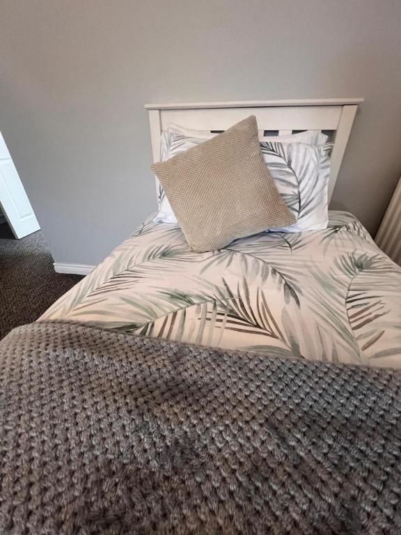 A bed or beds in a room at Rest a While