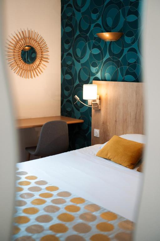 Postel nebo postele na pokoji v ubytování Hôtel Bellevue