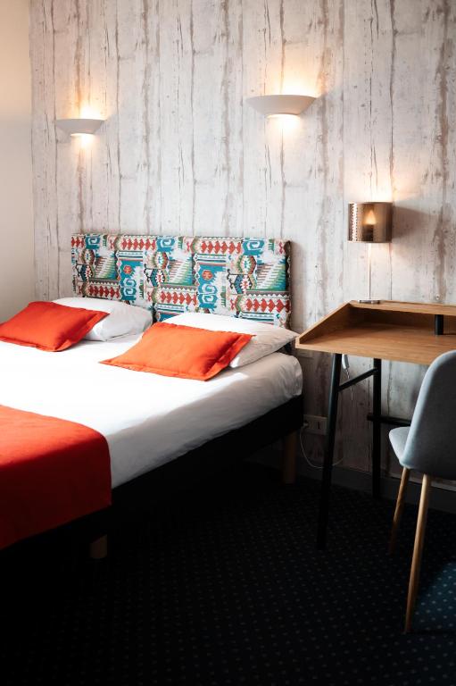 Postel nebo postele na pokoji v ubytování Hôtel Bellevue