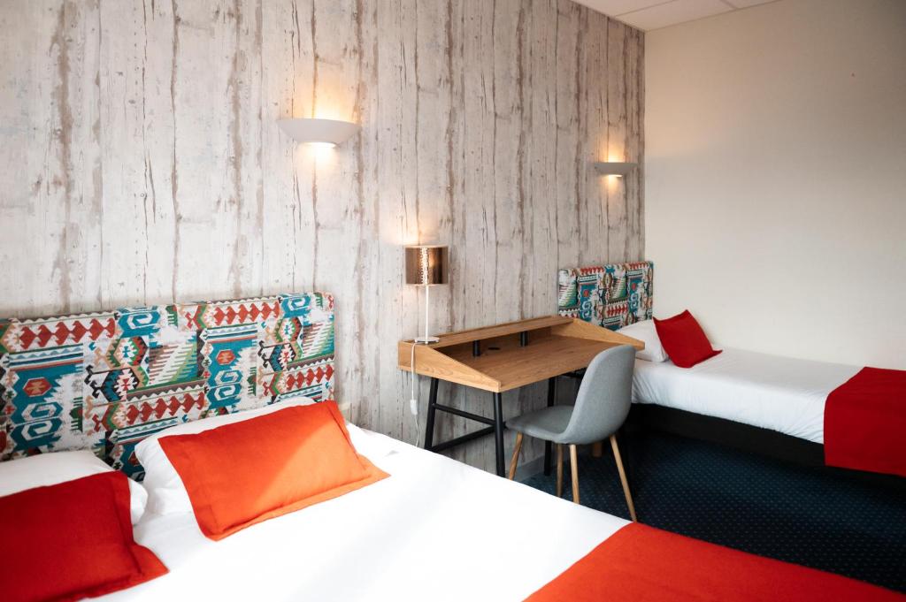 Postel nebo postele na pokoji v ubytování Hôtel Bellevue