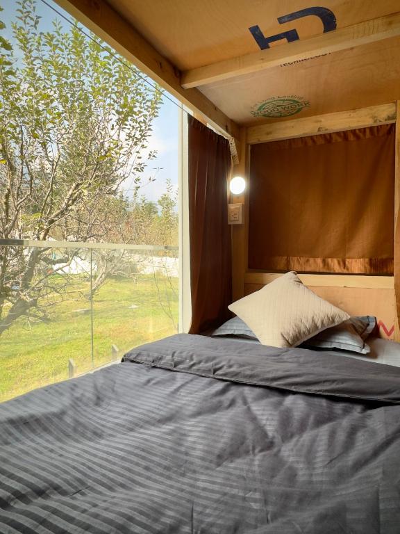 Postel nebo postele na pokoji v ubytování Baekar Stays