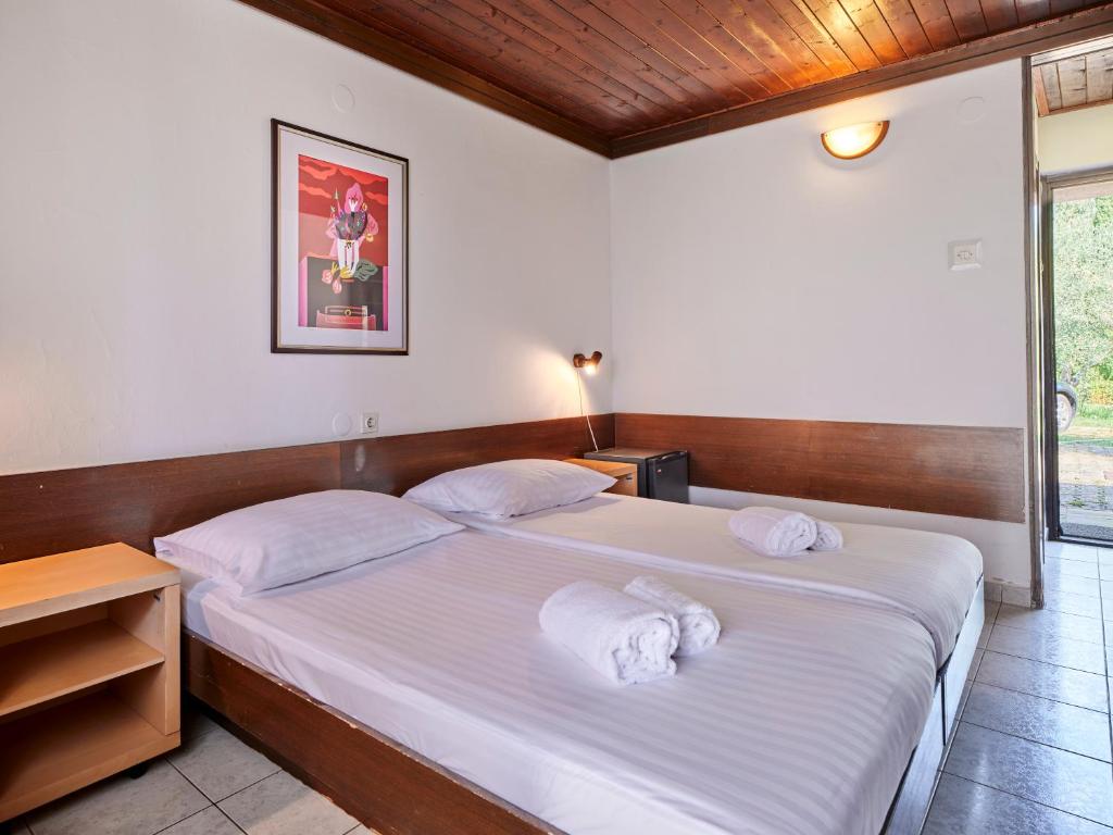 Postel nebo postele na pokoji v ubytování Koversada Rooms