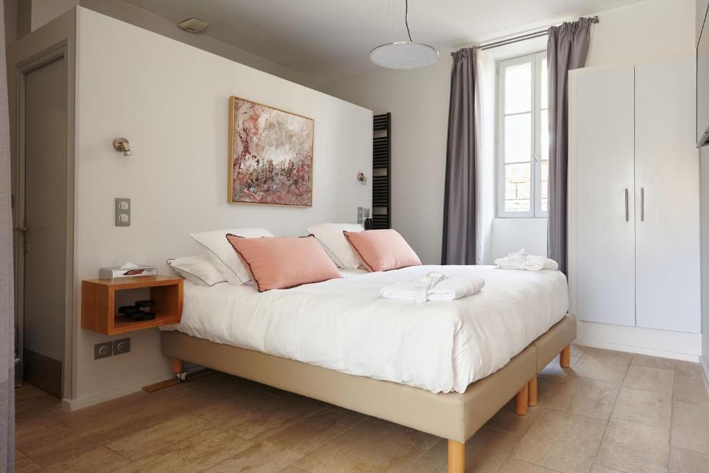 Postel nebo postele na pokoji v ubytování Boutique Hôtel Entraigues