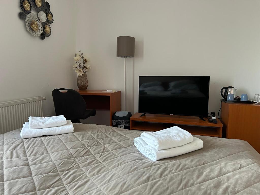 Postel nebo postele na pokoji v ubytování Hotel Evan u Hoffera