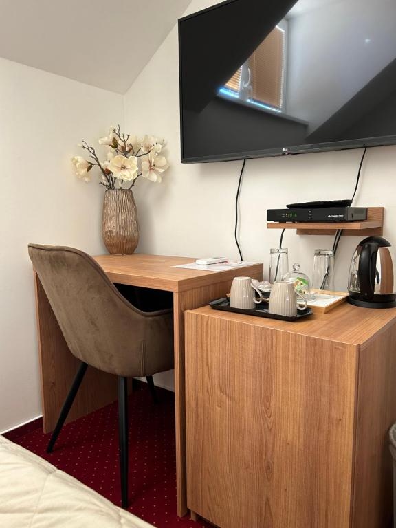 TV a/nebo společenská místnost v ubytování Hotel Evan u Hoffera