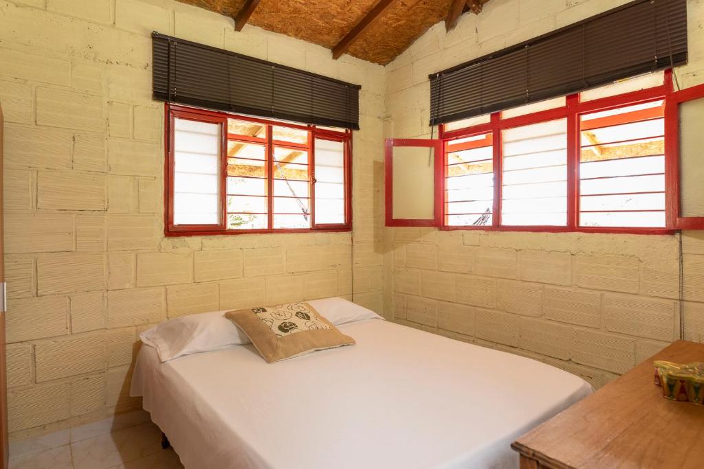 Postel nebo postele na pokoji v ubytování Finca Villa Arca