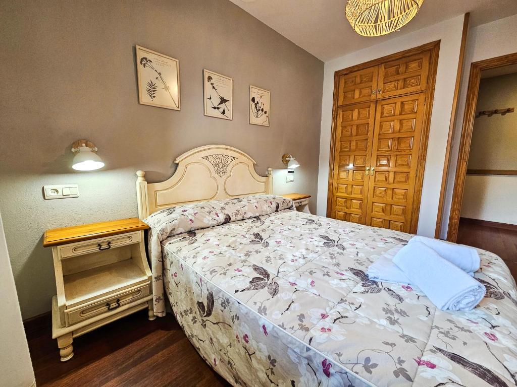 Postel nebo postele na pokoji v ubytování Apartamentos Casa Boira 3000