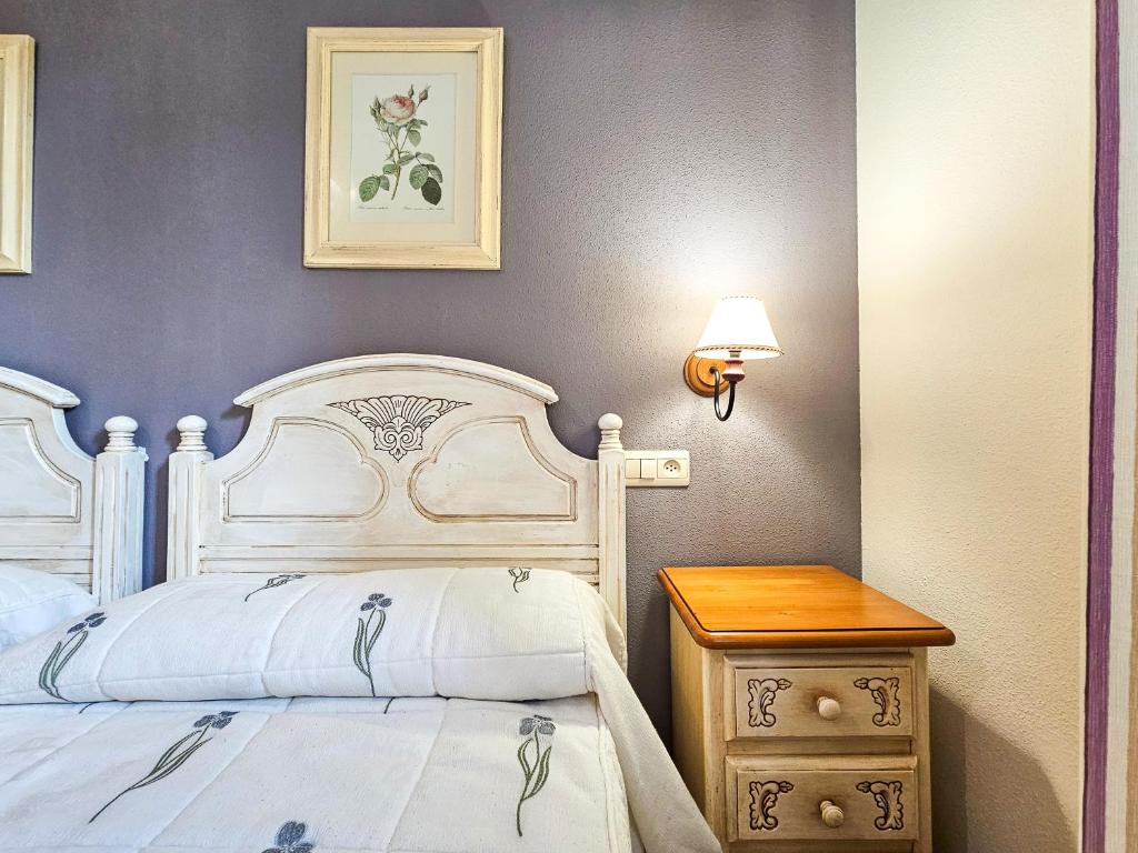Postel nebo postele na pokoji v ubytování Apartamentos Casa Boira 3000