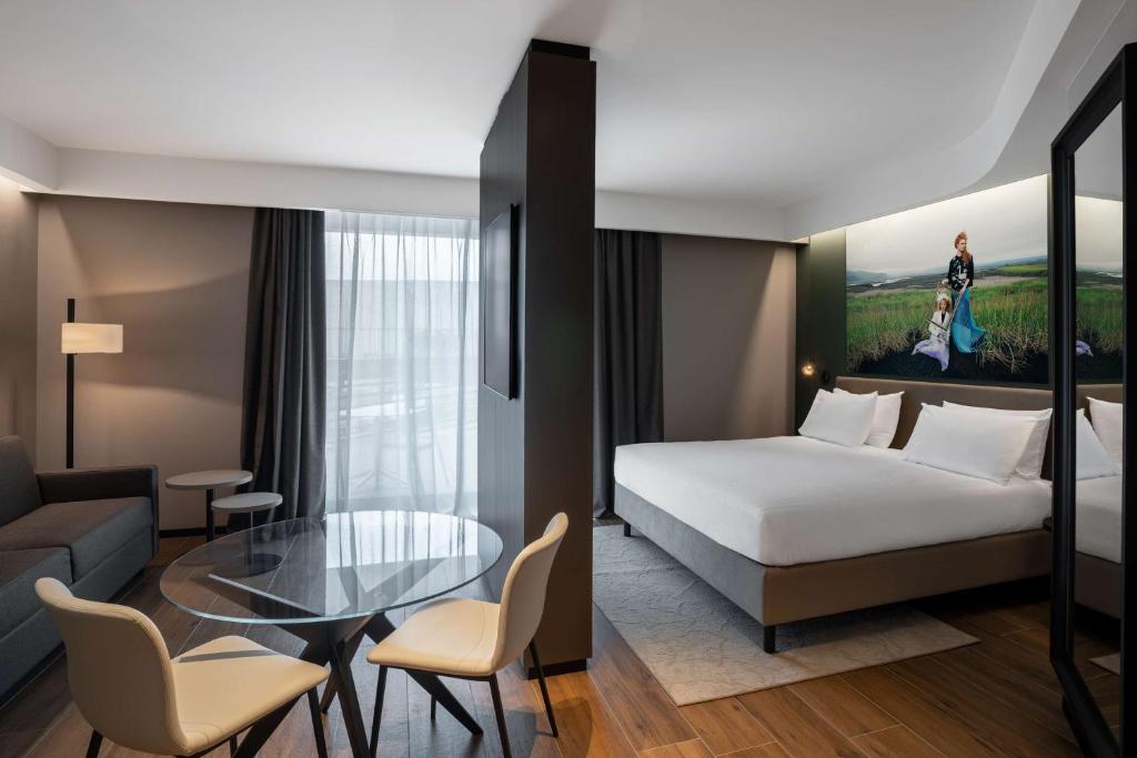 Postel nebo postele na pokoji v ubytování Radisson Blu Hotel, Bergamo ChorusLife