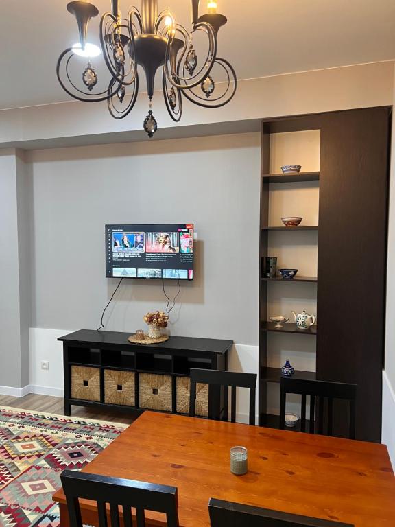 TV a/nebo společenská místnost v ubytování Cozy Flat