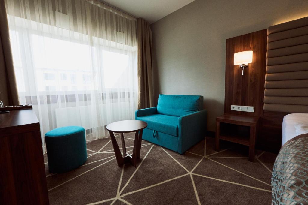 Posezení v ubytování Puzzle Hotel Airport Frankfurt
