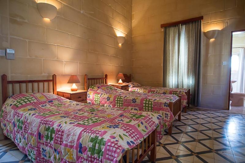 Ένα ή περισσότερα κρεβάτια σε δωμάτιο στο 4 Bedroom Farmhouse with Private Pool