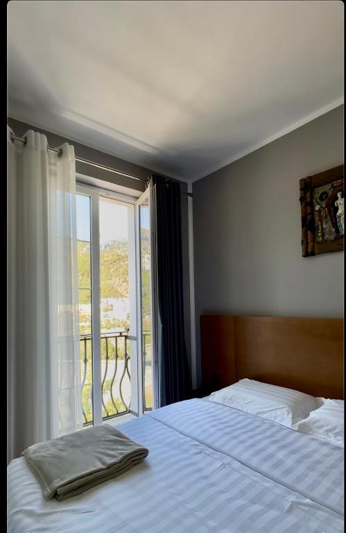 Postel nebo postele na pokoji v ubytování Hotel Rubin