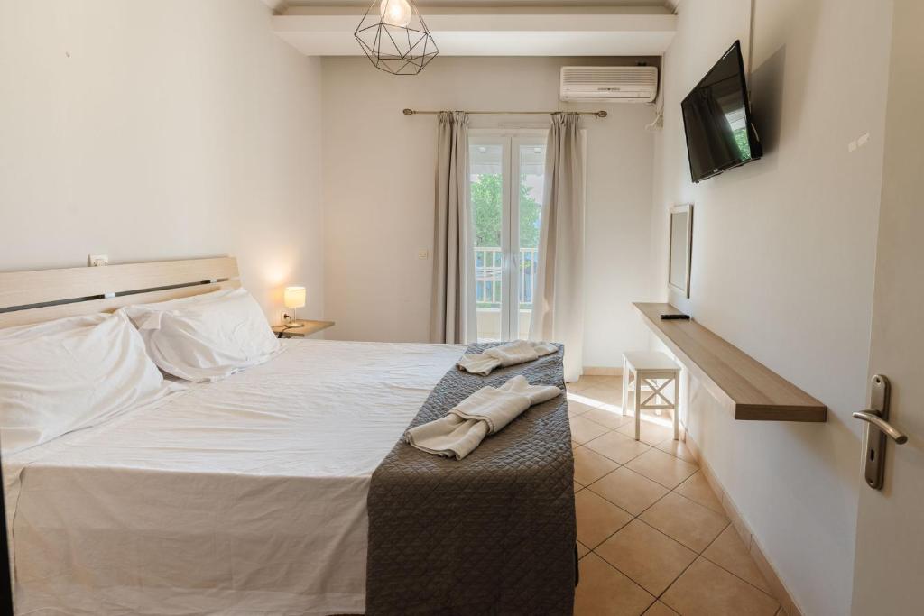 Postel nebo postele na pokoji v ubytování Spyridoula Resort in Corfu