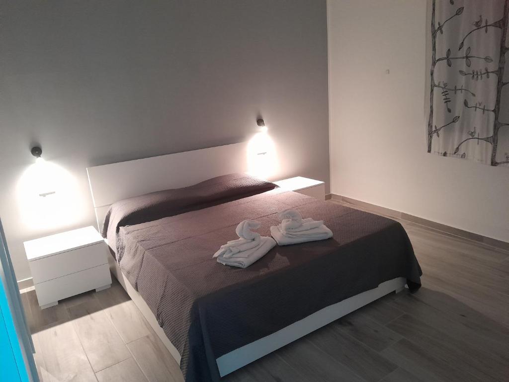 Postel nebo postele na pokoji v ubytování Casa vacanza La rosa dei venti
