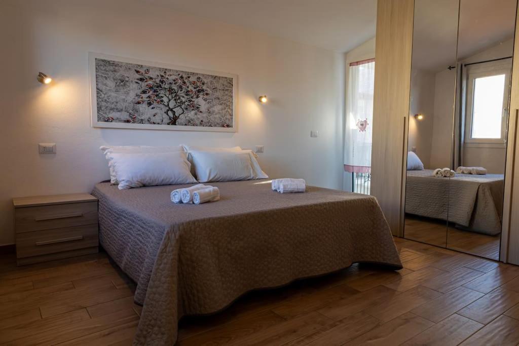 Postel nebo postele na pokoji v ubytování Elegante Rifugio Appartamento con 1 camera da letto 4 Adulti Wi-Fi Netflix