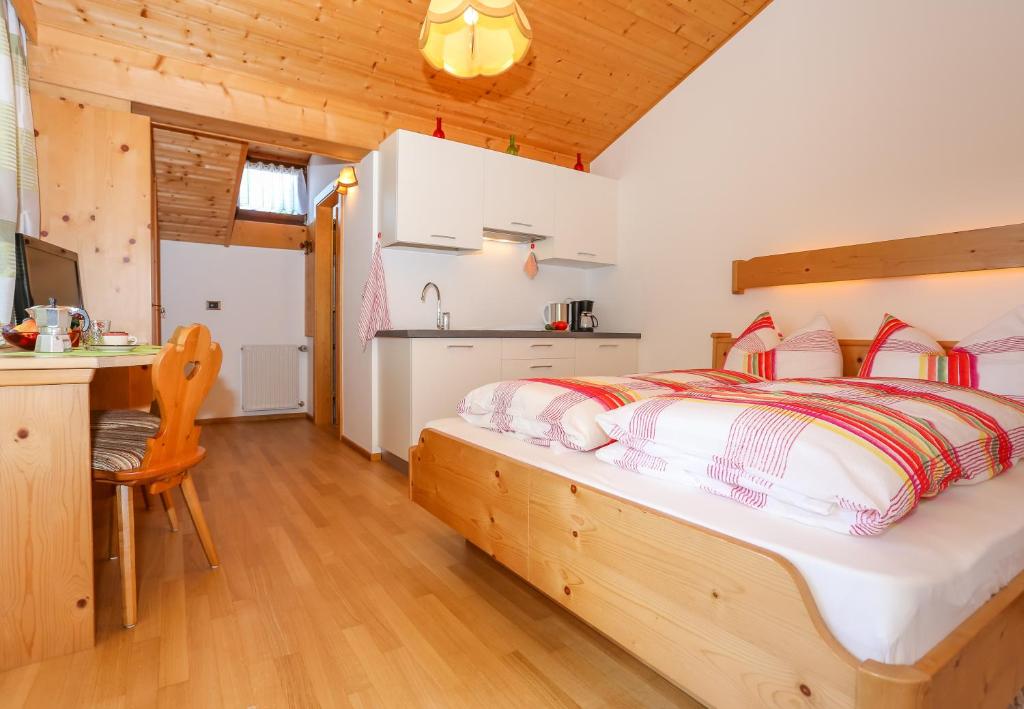 Posteľ alebo postele v izbe v ubytovaní Alps Residence