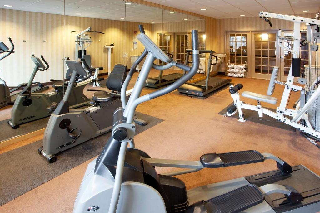 a gym with several exercise bikes and tread machines at Holiday Inn Express Hotel & Suites Hagerstown by IHG in Hagerstown