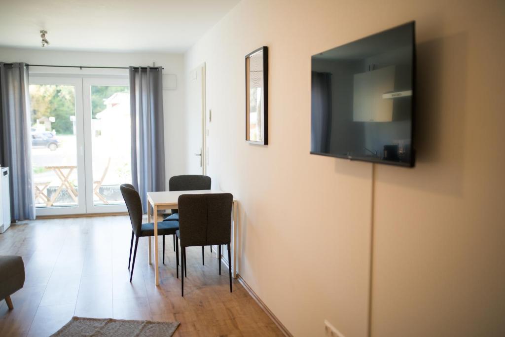 TV a/nebo společenská místnost v ubytování HUGOS Studio Apartment