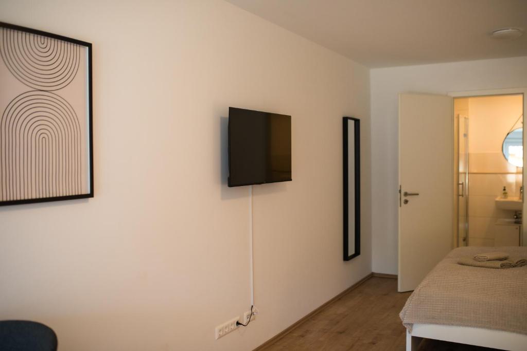 Postel nebo postele na pokoji v ubytování HUGOS Studio Apartment