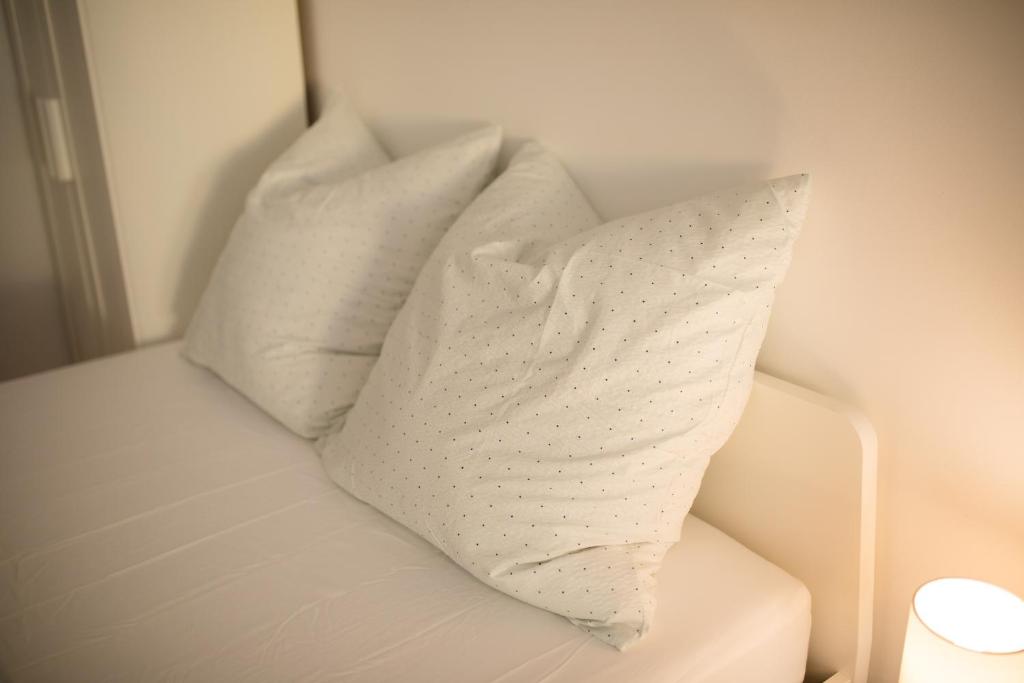Postel nebo postele na pokoji v ubytování HUGOS Studio Apartment