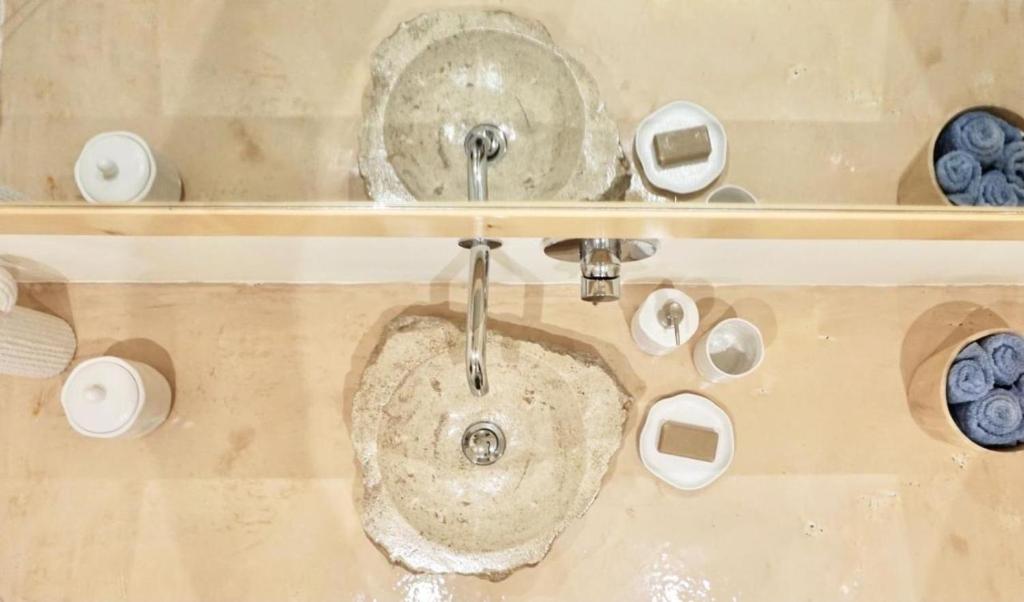 a bathroom with a sink with a faucet at Casa da Leoa in Sal Rei