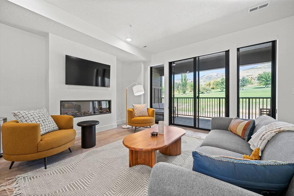 a living room with a couch and chairs and a fireplace at Golf and Ski Haven in Eden on Golf Course Pt C208 in Mountain View Estates