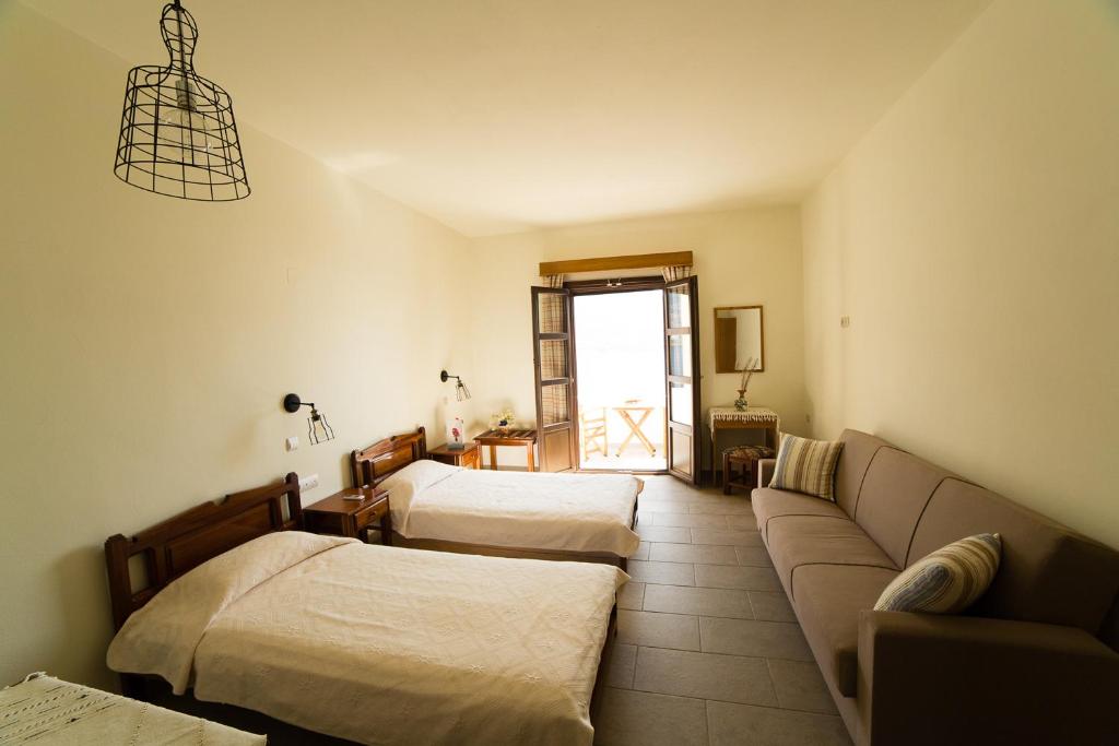 Postel nebo postele na pokoji v ubytování Hotel Porto Potha