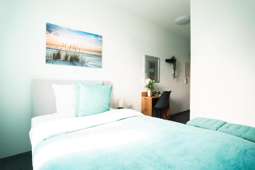 Postel nebo postele na pokoji v ubytování Hotel am Schafbaum