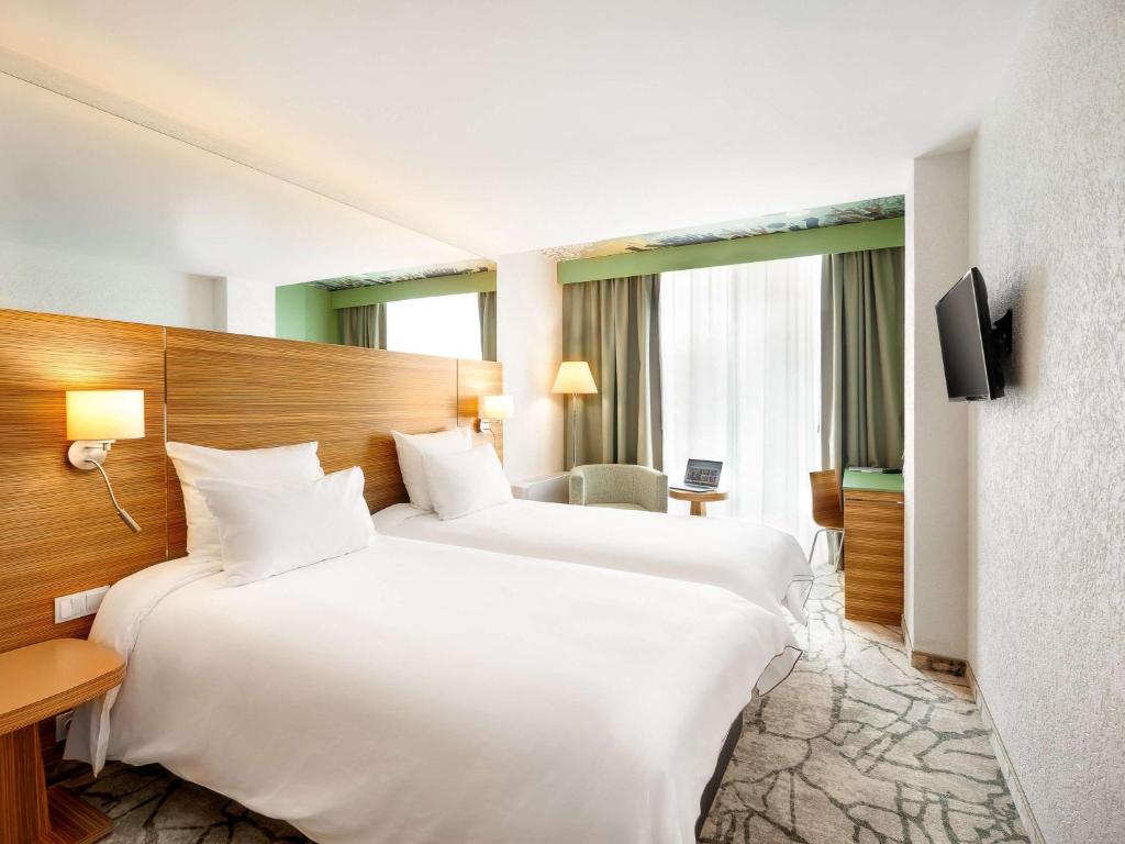 Voodi või voodid majutusasutuse Mercure Tallinn toas