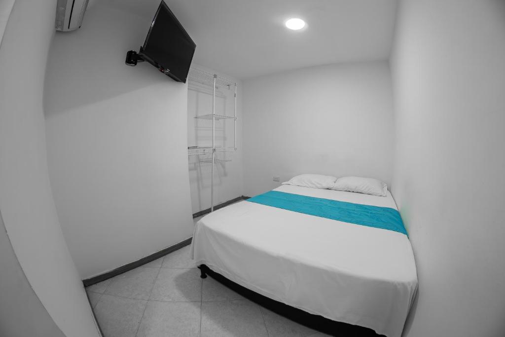 Postel nebo postele na pokoji v ubytování Hotel Santander Plaza