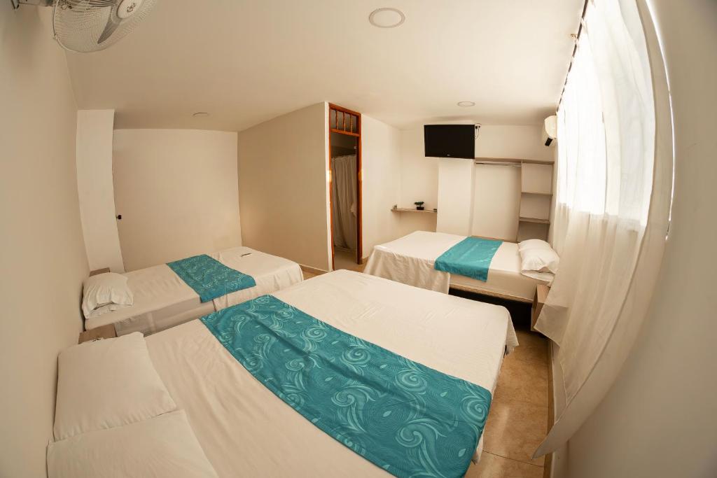 Postel nebo postele na pokoji v ubytování Hotel Santander Plaza