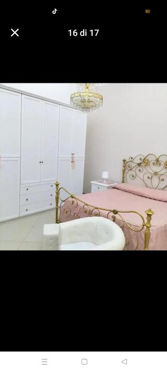 a bathroom with a bed and a bath tub at Suit catania1946 in Catania