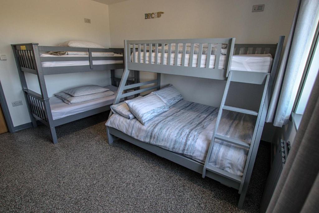 Ένα ή περισσότερα κρεβάτια σε δωμάτιο στο Ballygally Farm Accommodation