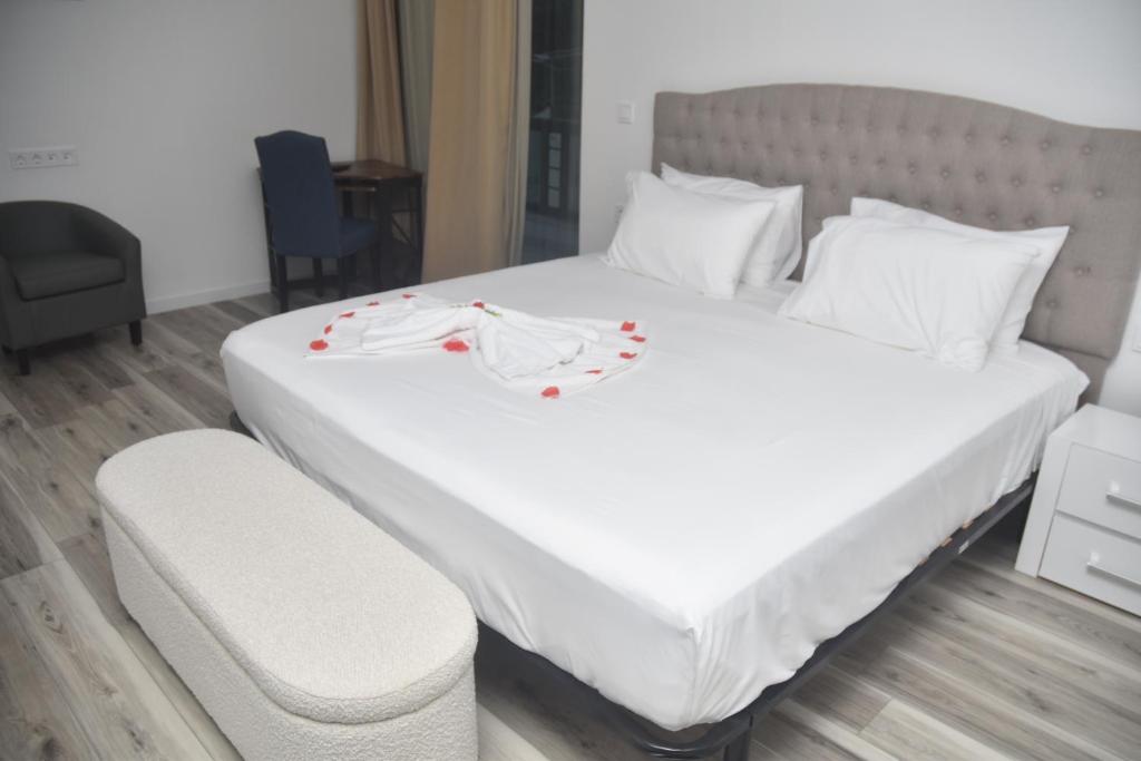 Postel nebo postele na pokoji v ubytování Hotel Cantinho