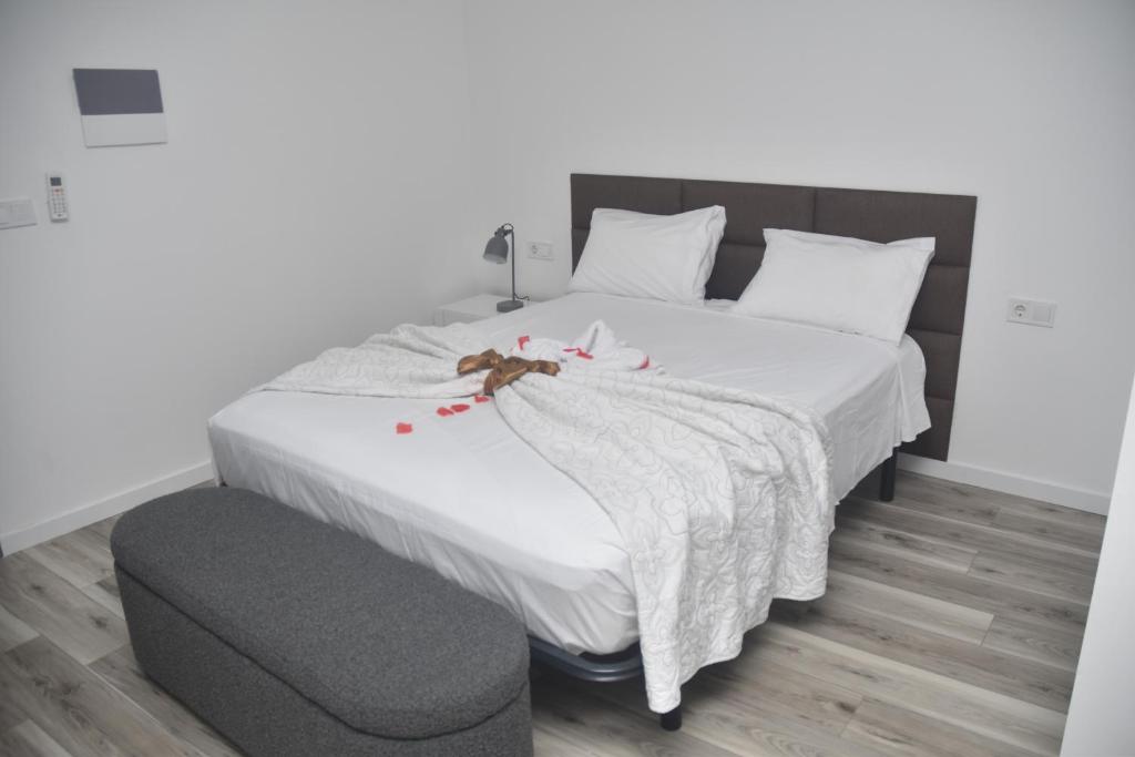 Postel nebo postele na pokoji v ubytování Hotel Cantinho