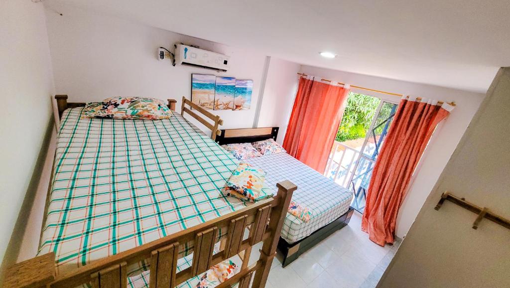 Postel nebo postele na pokoji v ubytování Casa Hotel Isabella