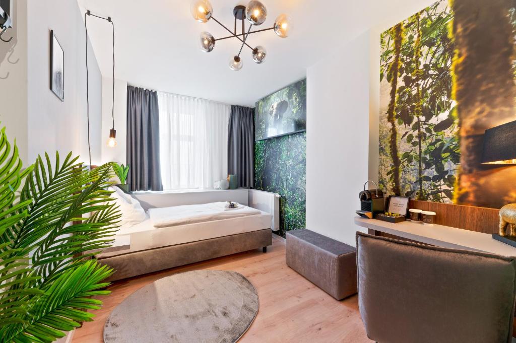 Postel nebo postele na pokoji v ubytování JUNGLE No5 Boutique Hotel - Stuttgart City-Center